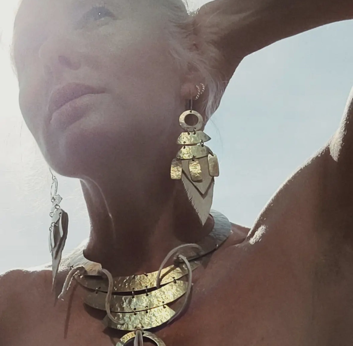 Brass and leather feather earrings by Bisjoux