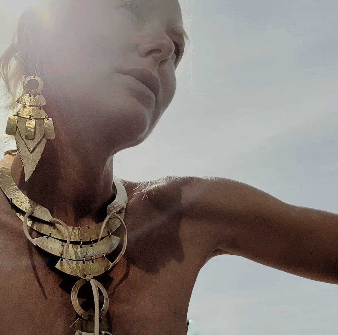 Brass and leather feather earrings by Bisjoux